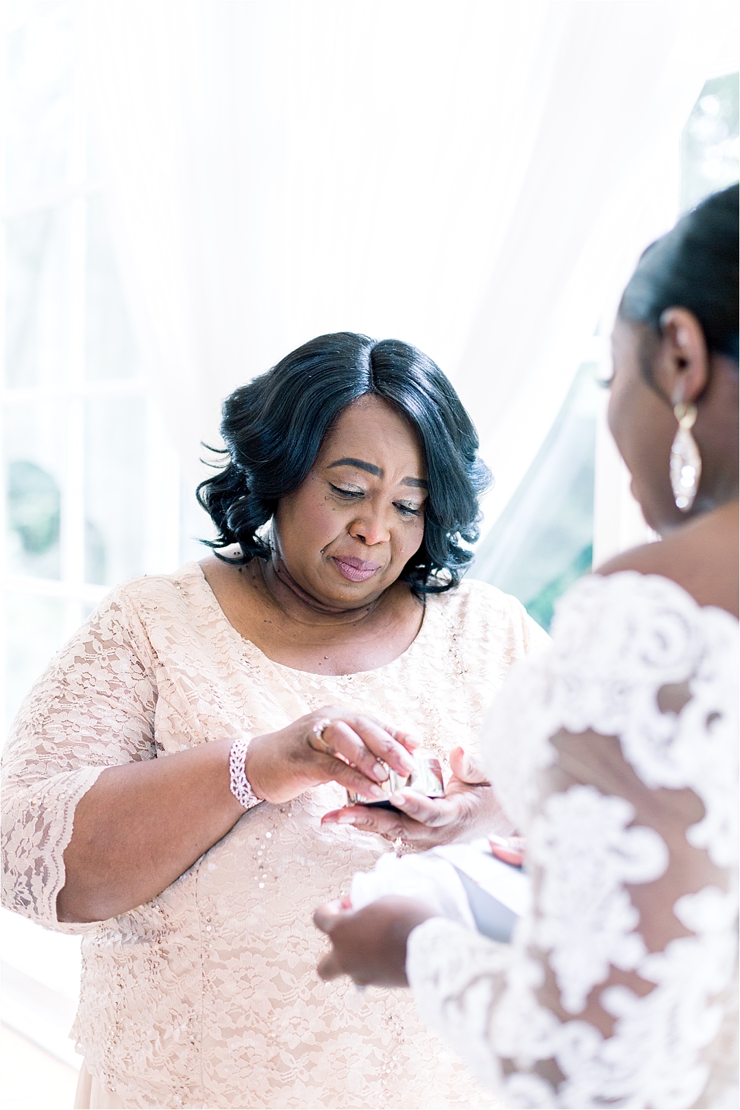 mother helping daughter on wedding day_Photos by Leigh Wolfe, Atlanta's Top Wedding Photographer