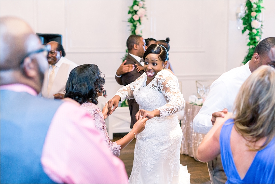 bride dancing with mom_Photos by Leigh Wolfe, Atlanta's Top Wedding Photographer