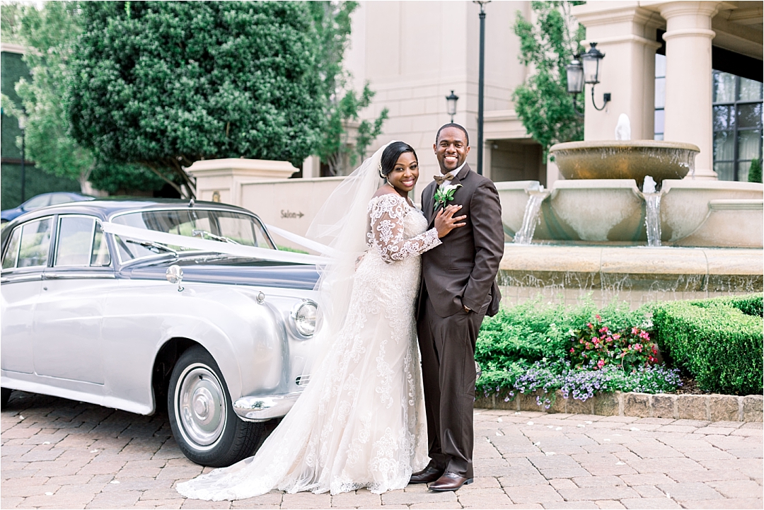 bride and groom with vintage car_Photos by Leigh Wolfe, Atlanta's Top Wedding Photographer