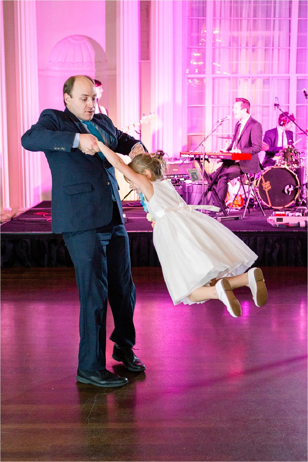 little girl dancing and spinning at wedding_Photos by Leigh Wolfe, Atlanta's top wedding photographer