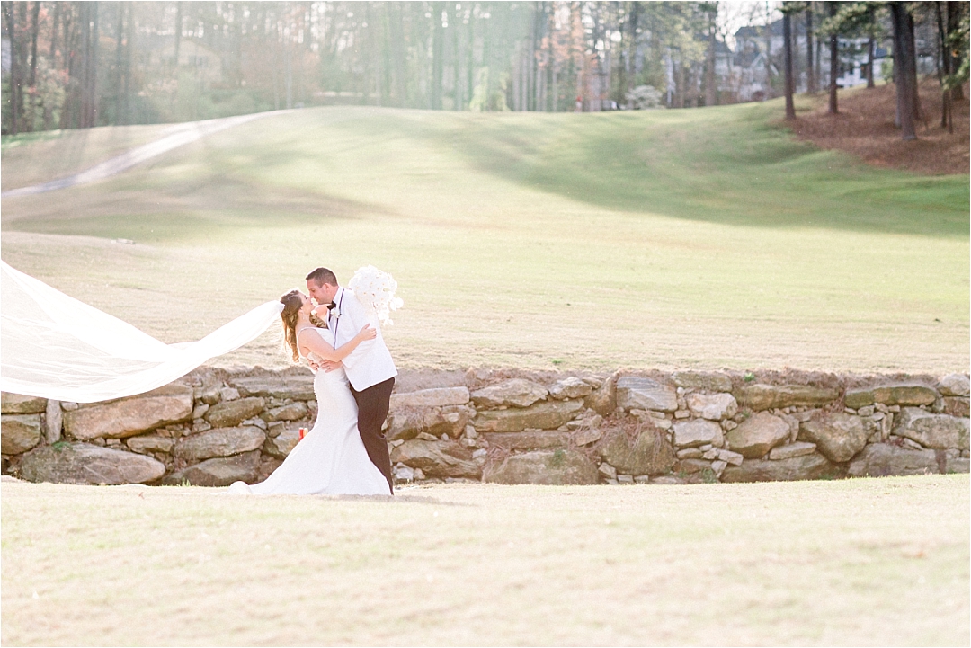 bride and groom on golf course_Photos by Leigh Wolfe, Atlanta's Top Wedding Photographer