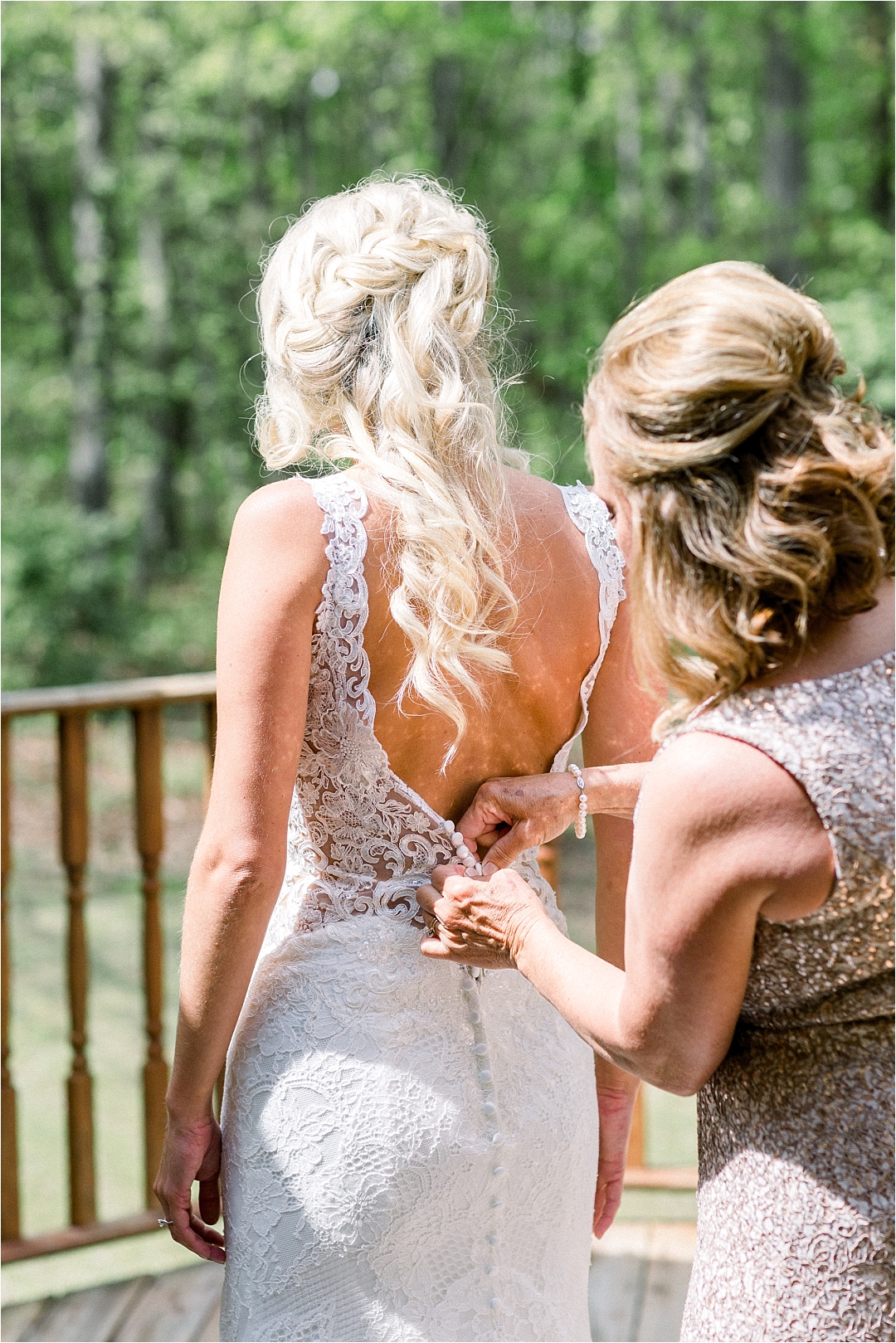 Mom helping daughter into lace wedding dress_Photos by Leigh Wolfe, Atlanta's Top Wedding Photographer