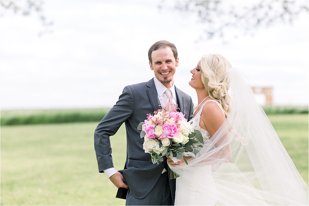 bride with blush flowers and veil_Photos by Leigh Wolfe, Atlanta's Top Wedding Photographer