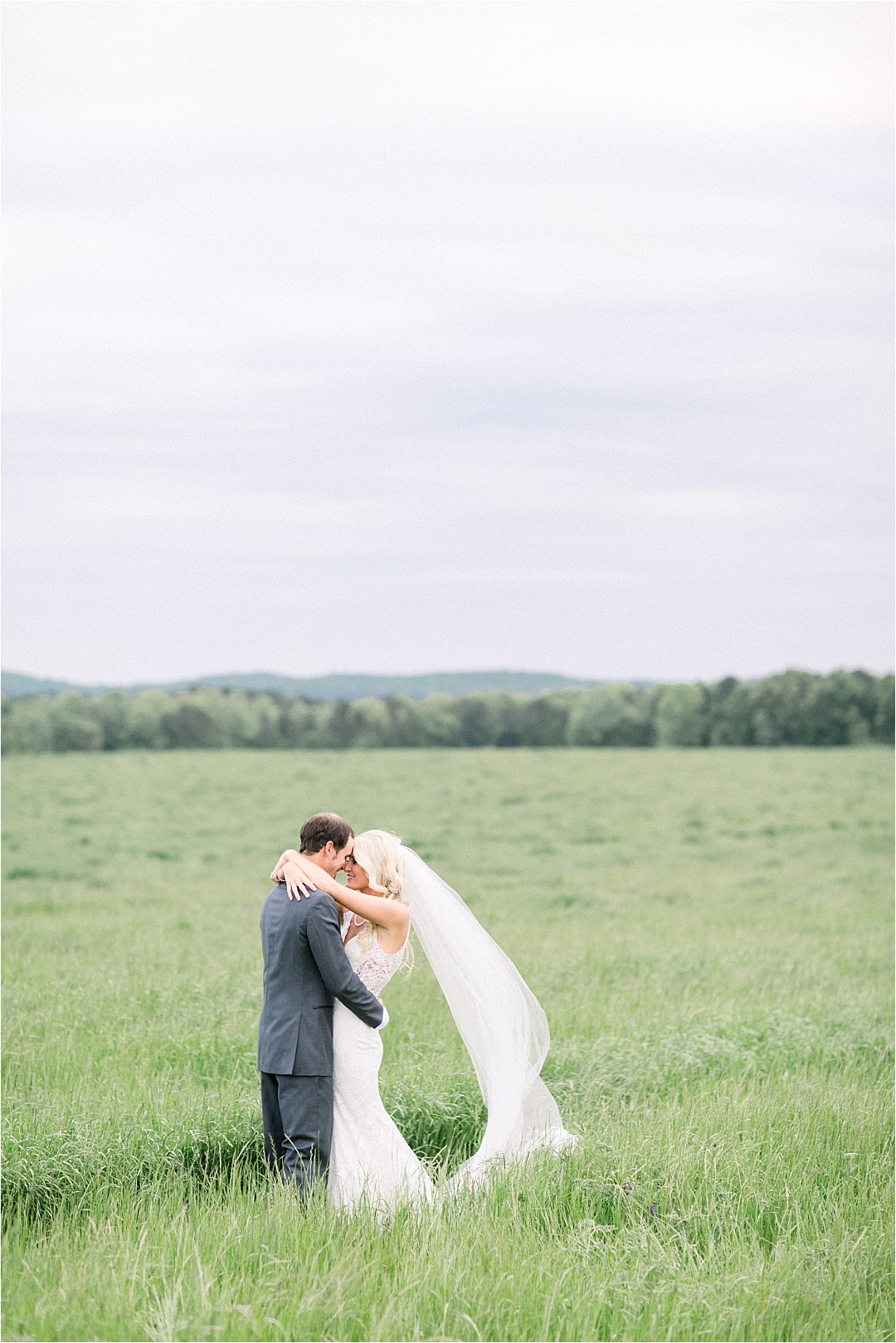 bride and groom in field_Photos by Leigh Wolfe, Atlanta's Top Wedding Photographer