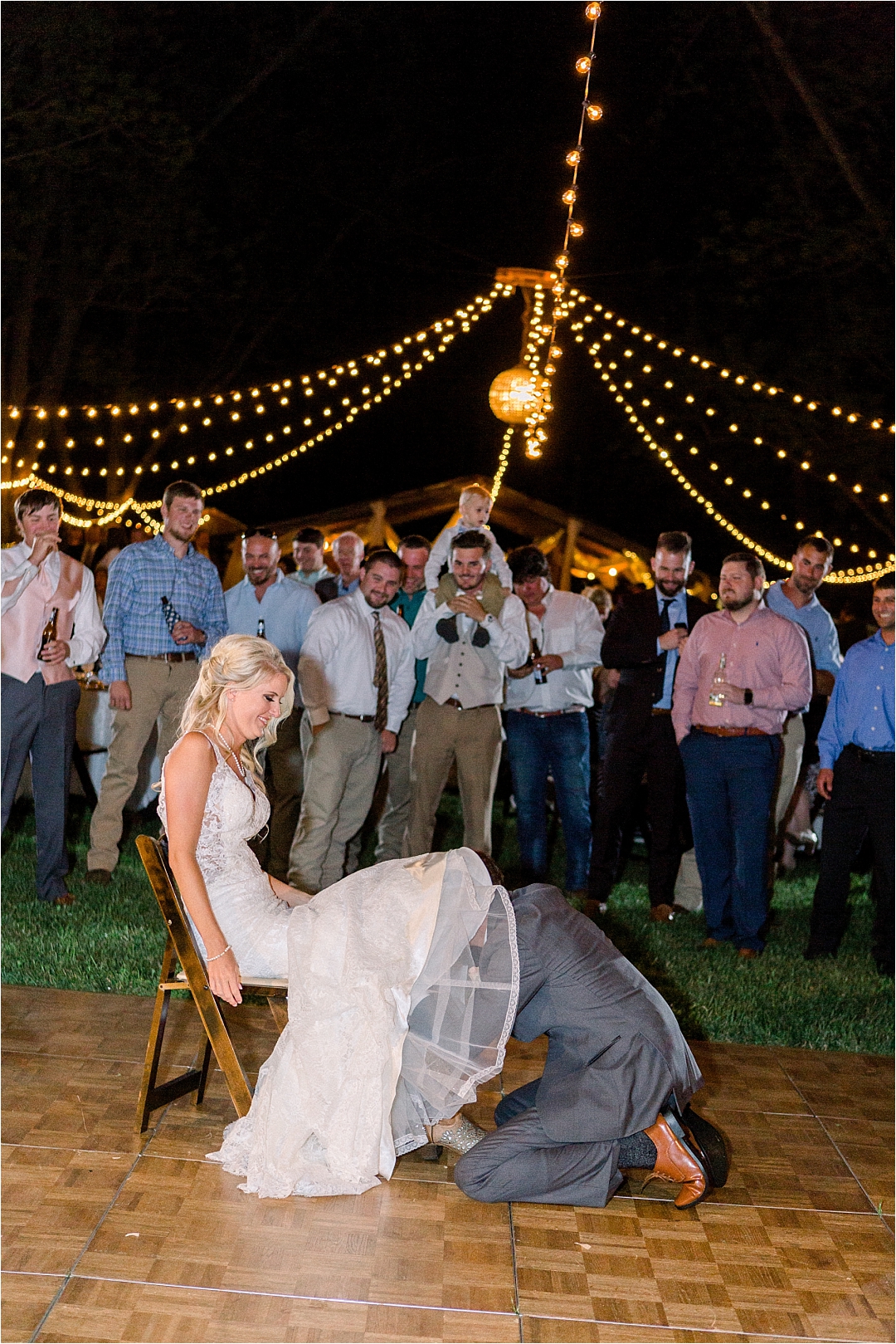 groom under brides dress_Photos by Leigh Wolfe, Atlanta's Top Wedding Photographer