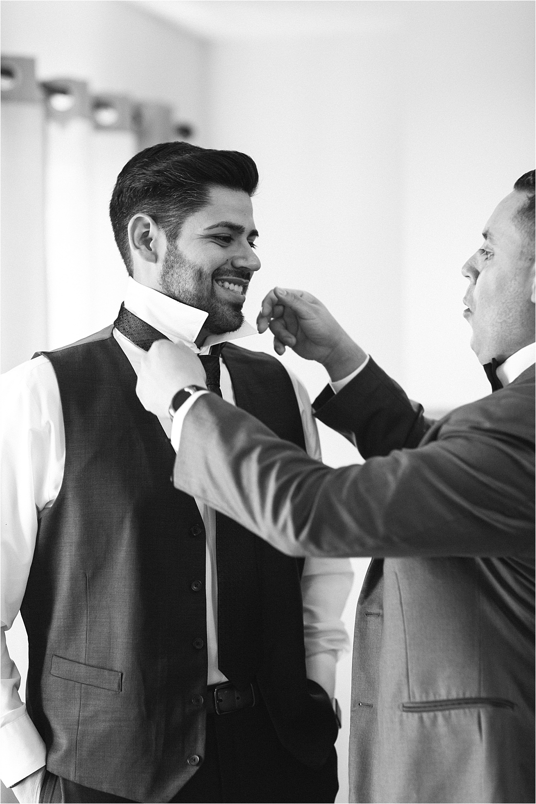 dad helping groom dress_Photos by Leigh Wolfe, Atlanta's Top Wedding Photographer