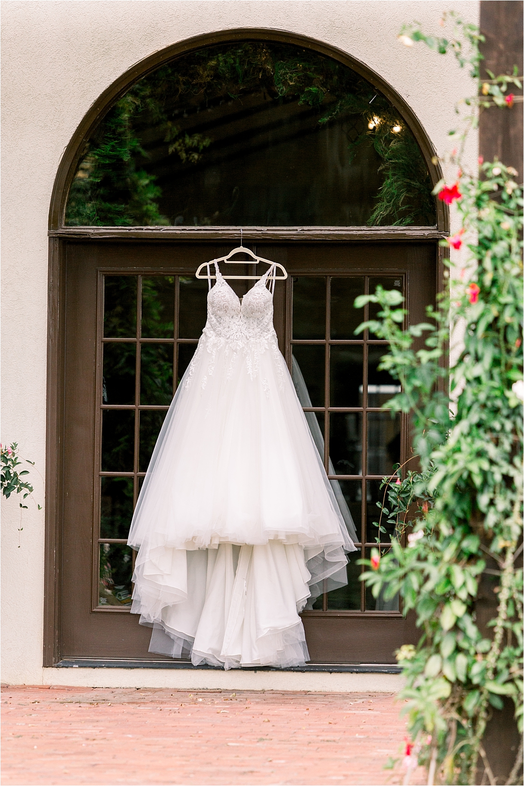 wedding dress hanging in front of door_Photos by Leigh Wolfe, Atlanta's Top Wedding Photographer
