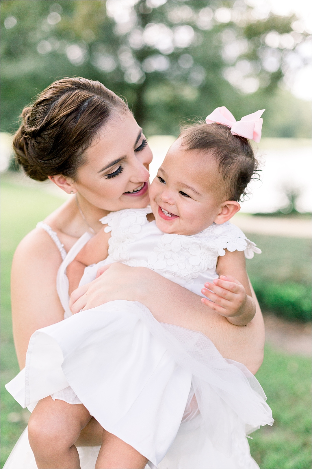 bride with baby flower girl_Photos by Leigh Wolfe, Atlanta's Top Wedding Photographer