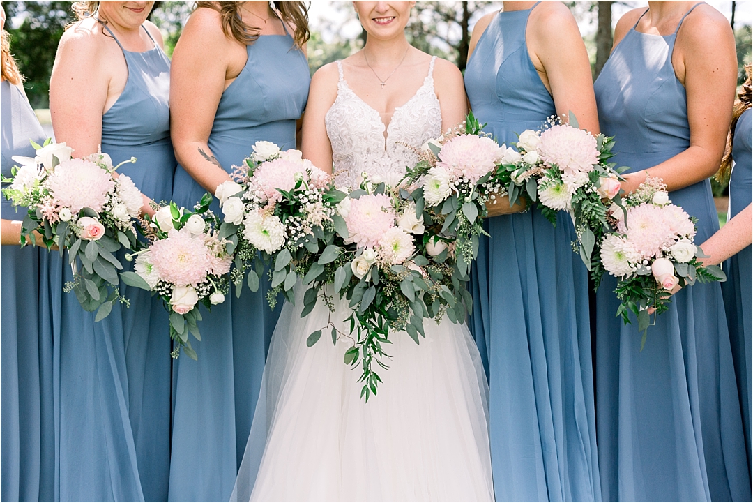 bride with bridesmaids and flowers_Photos by Leigh Wolfe, Atlanta's Top Wedding Photographer