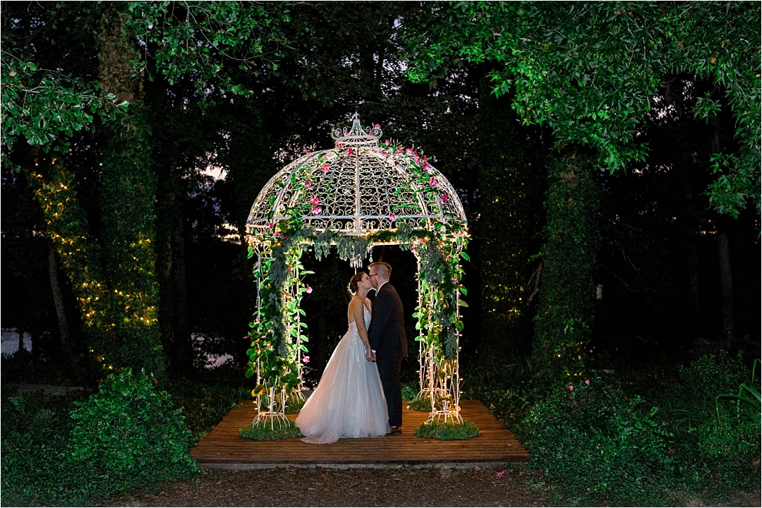 bride and groom under garden lights_Photos by Leigh Wolfe, Atlanta's Top Wedding Photographer