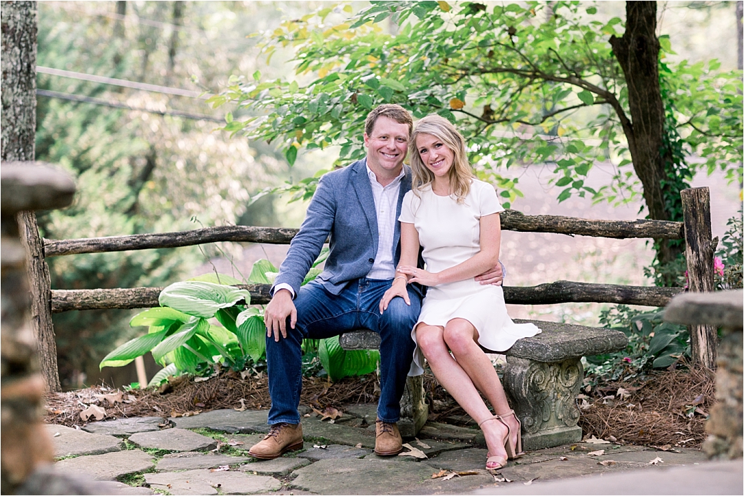 Couple sitting on rustic bench_Photos by Leigh Wolfe, Atlanta's Top Wedding Photographer