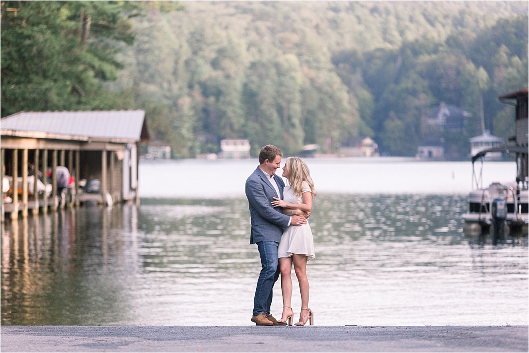couple standing by lake in engagement session_Photos by Leigh Wolfe, Atlanta's Top Wedding Photographer