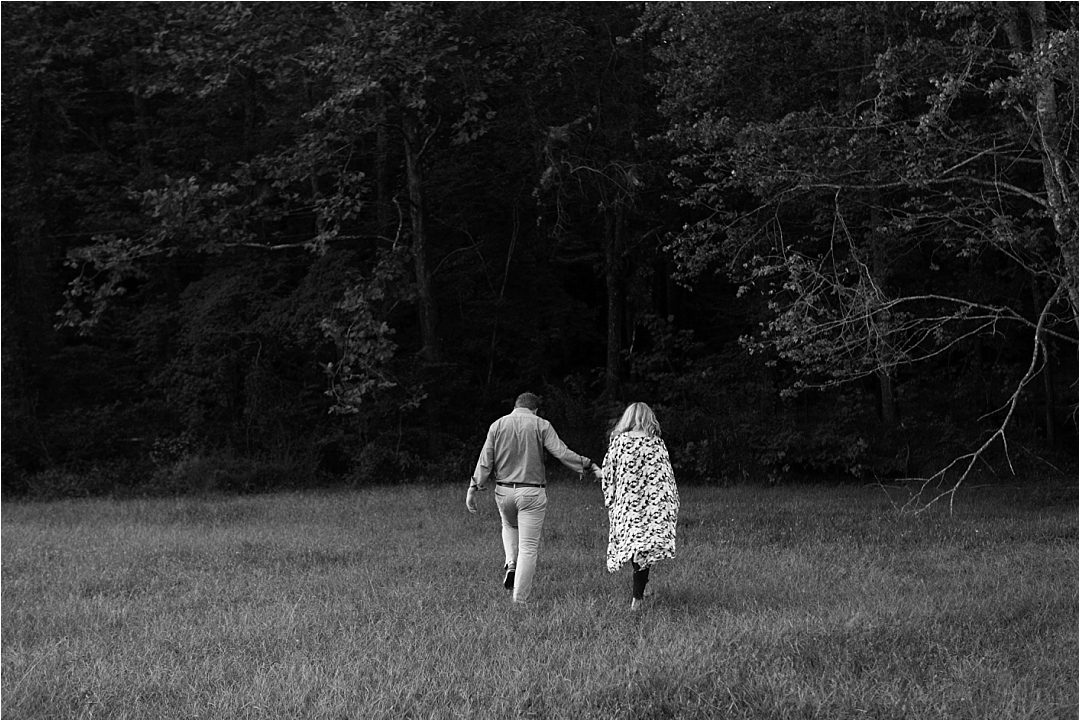 couple walking towards woods in the evening_Photos by Leigh Wolfe, Atlanta's Top Wedding Photographer