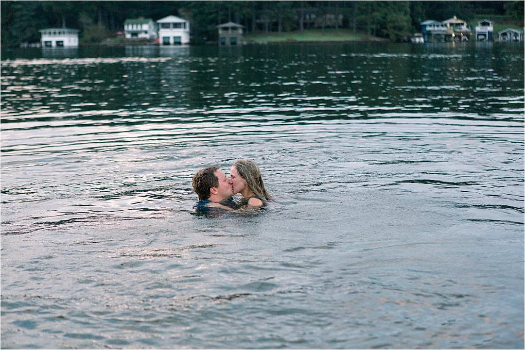 couple kissing in the water after jumping off boat_Photos by Leigh Wolfe, Atlanta's Top Wedding Photographer