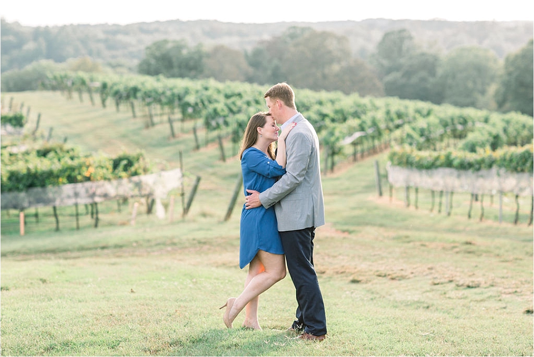 couple kissing at vineyard_Photos by Leigh Wolfe, Atlanta's Top Wedding Photographer