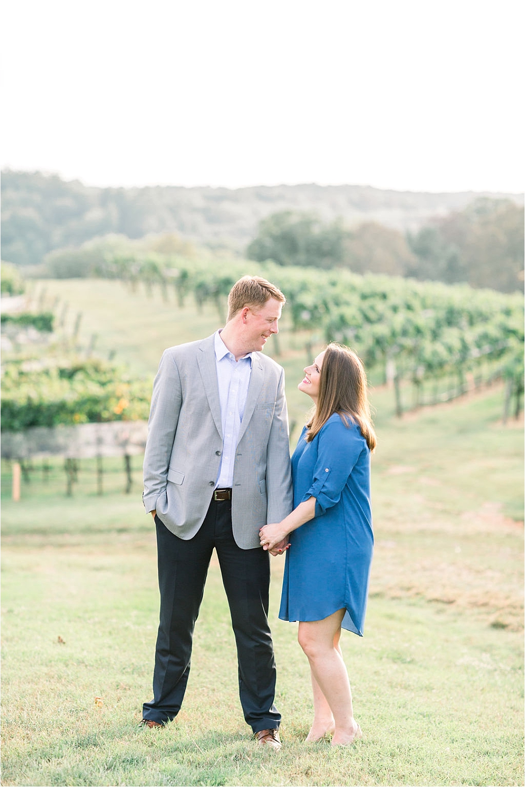 couple holding hands on hill at winery_Photos by Leigh Wolfe, Atlanta's Top Wedding Photographer