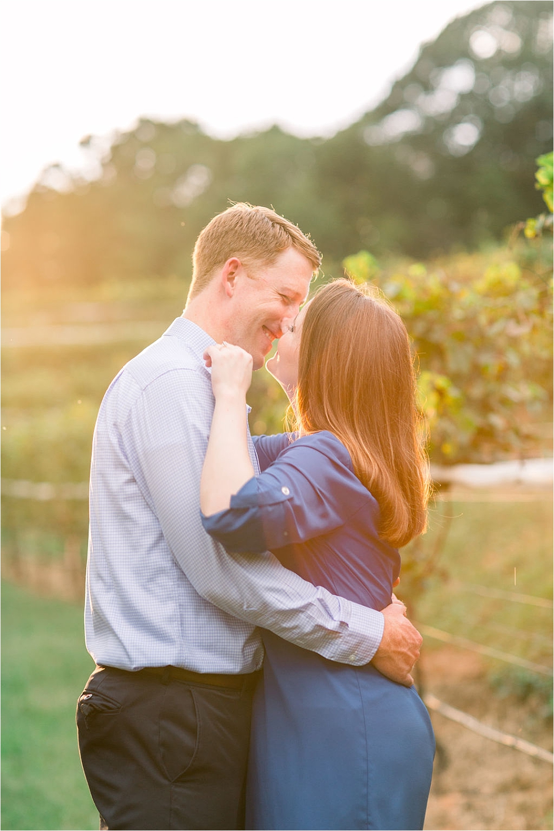couple kissing at winery_Photos by Leigh Wolfe, Atlanta's Top Wedding Photographer