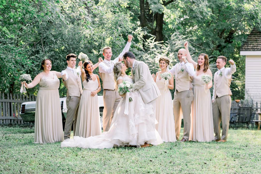 Fun bridal party shots! Bridal party wears neutrals and flower crowns at this private property wedding in Atlanta. Images by Leigh Wolfe Photography.