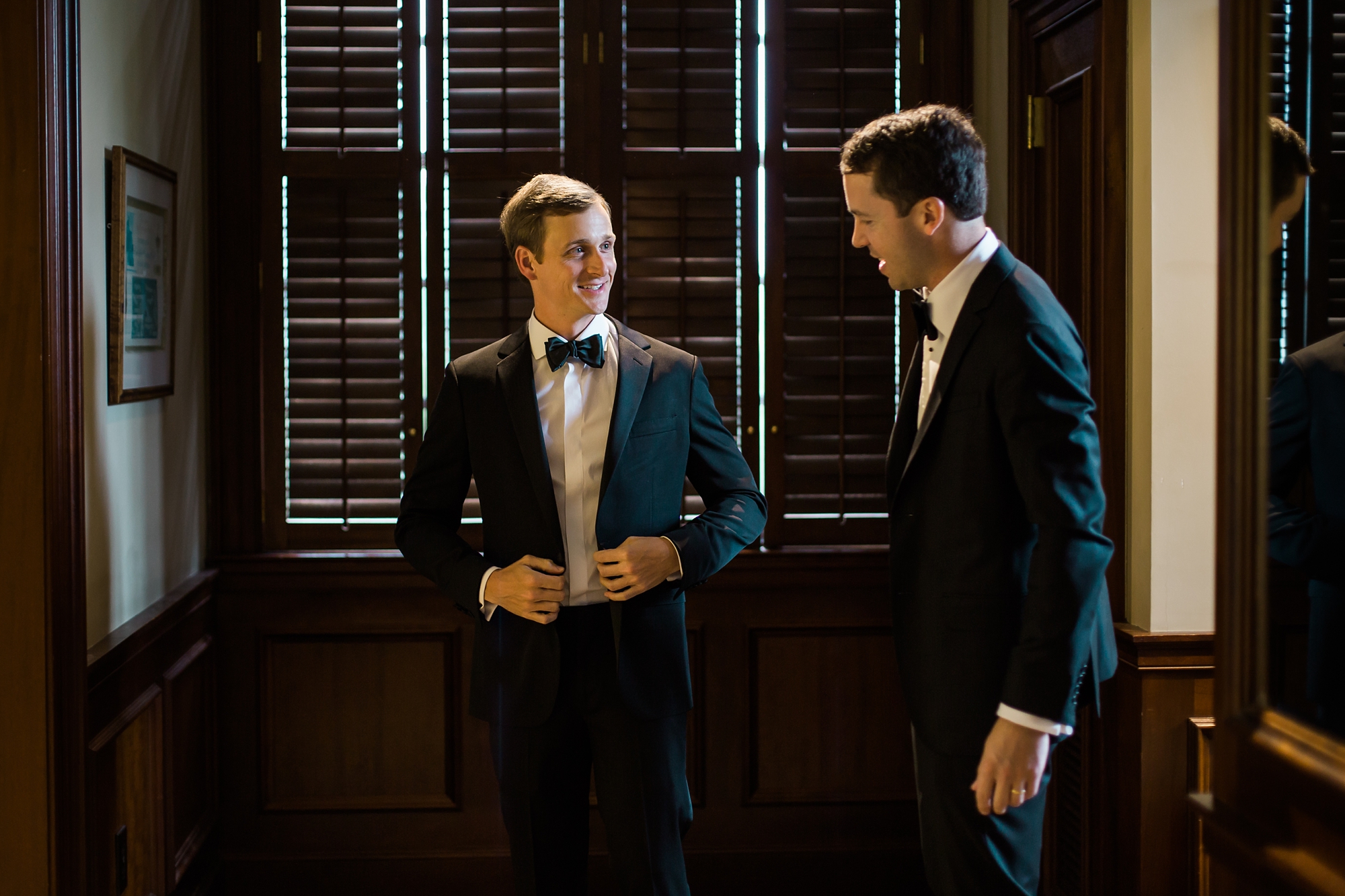 Groom getting ready at East Lake Golf Club in the Champions Locker Room by Leigh Wolfe Photography