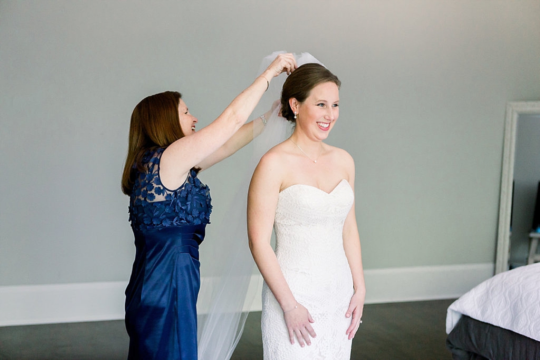 Mother helping her daughter get ready for her wedding day-Photos by Leigh Wolfe, Atlanta's top wedding photographer