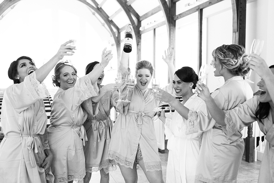 Bridesmaids popping Champagne_Wedding at Ashton Gardens_Chris and Maria_Top Georgia based wedding photographer Leigh Wolfe