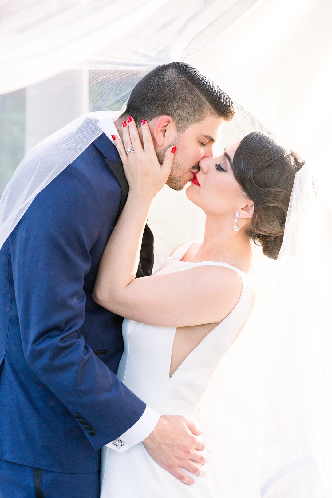 Bride and groom under veil_Photos by Leigh Wolfe, Atlanta's top wedding photographer
