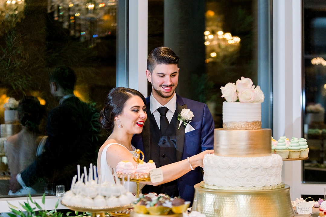 Bride and groom cutting wedding cake_Photos by Leigh Wolfe, Atlanta's top wedding photographer