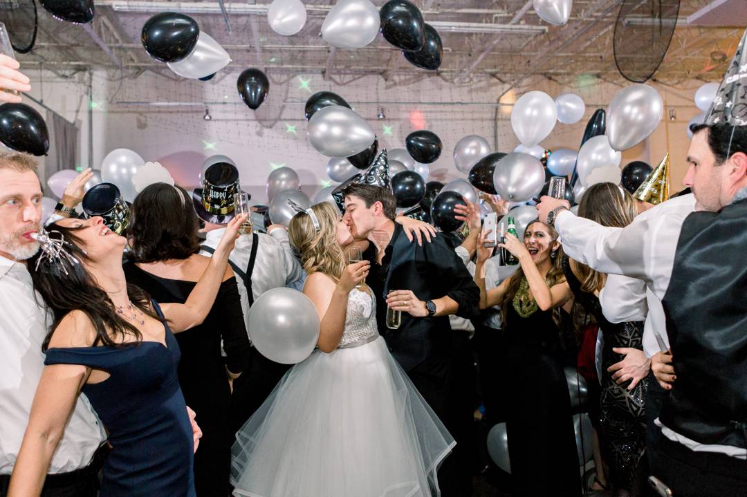 A balloon drop at midnight was the perfect ending to this wedding. NYE wedding at the Stave Room by Atlanta wedding photographer Leigh Wolfe Photography.