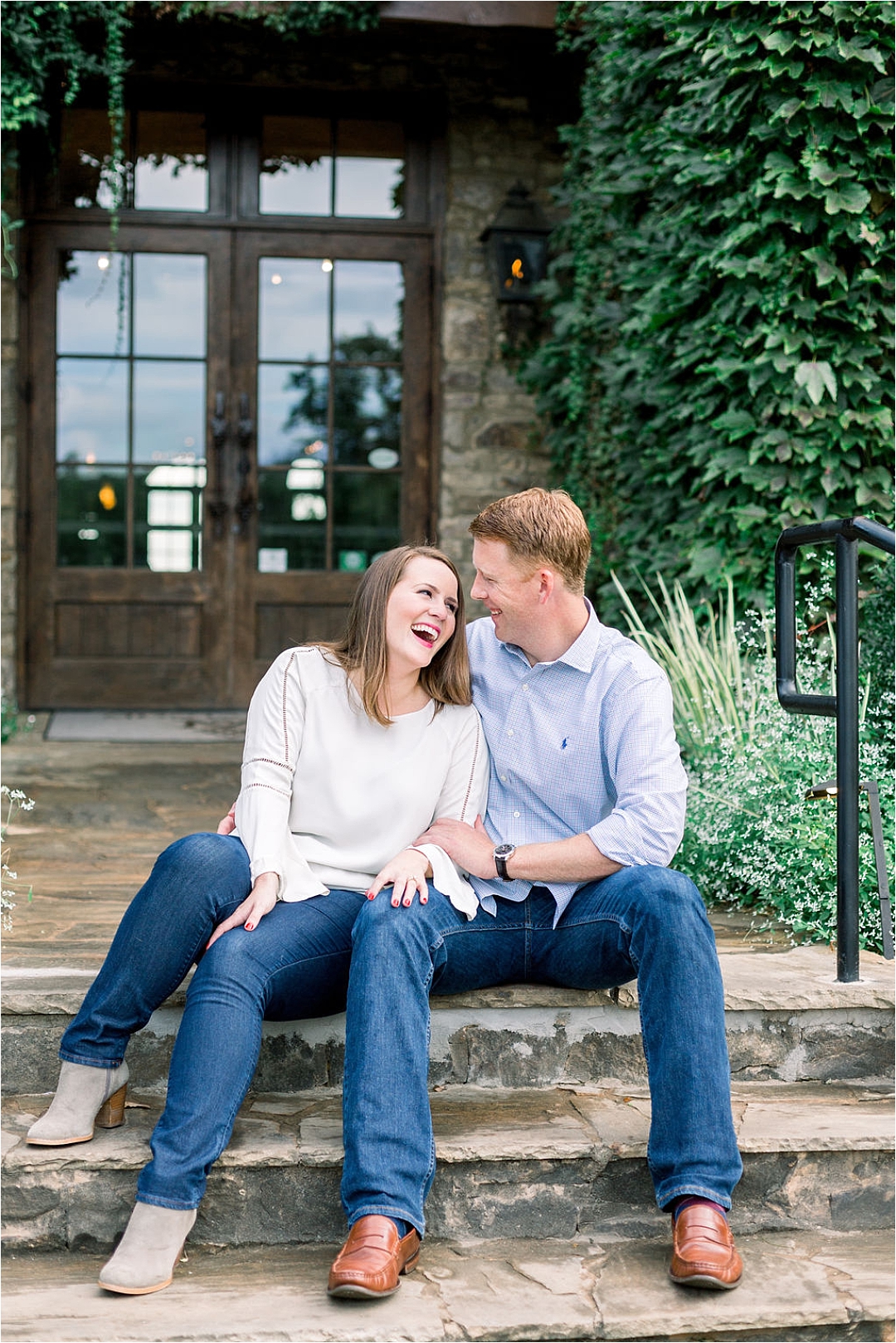 happy couple laughing on front porch steps_Photos by Leigh Wolfe, Atlanta's Top Wedding Photographer